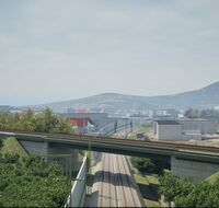 Kurz vor Freiburg führt das Gleis der Höllentalbahn auf einer Brücke über die zwei Gleise der Rheintalbahn.