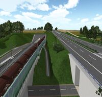 Ein Eisenbahntunnel führt an einer Autobahn entlang.