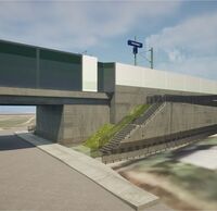Eine Brücke mit Schallschutzwänden führt über eine Straße.