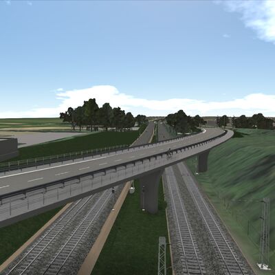 Eine Brücke für die Bundesstraße führt schräg über Bahngleise.