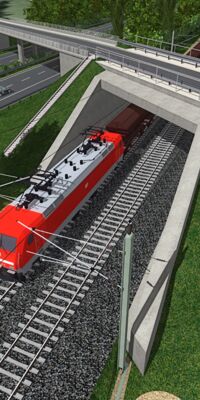 Ein roter Zug verlässt gerade einen Tunnel.