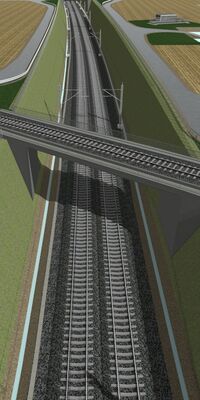 Zwei Gleise unterqueren eine Bahnstrecke.